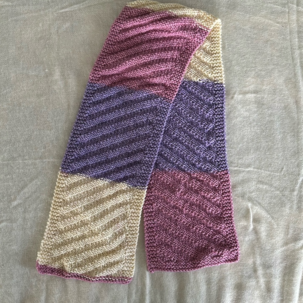 Hand-knit color block scarf in pink, purple and cream